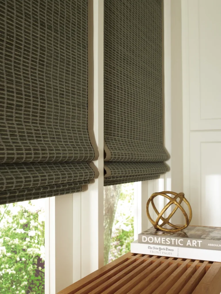Hunter Douglas Provenance Woven Wood Shades on windows above a wooden bench