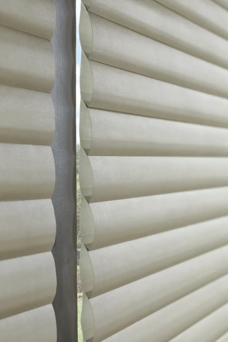 Close-up of Hunter Douglas Sonnette Cellular Roller Shades showing the curved cellular fabric